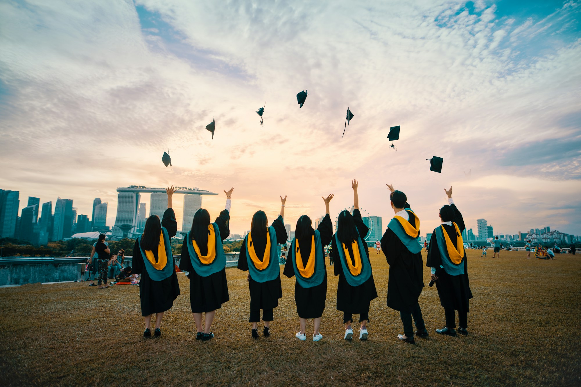 Graduates throwing caps